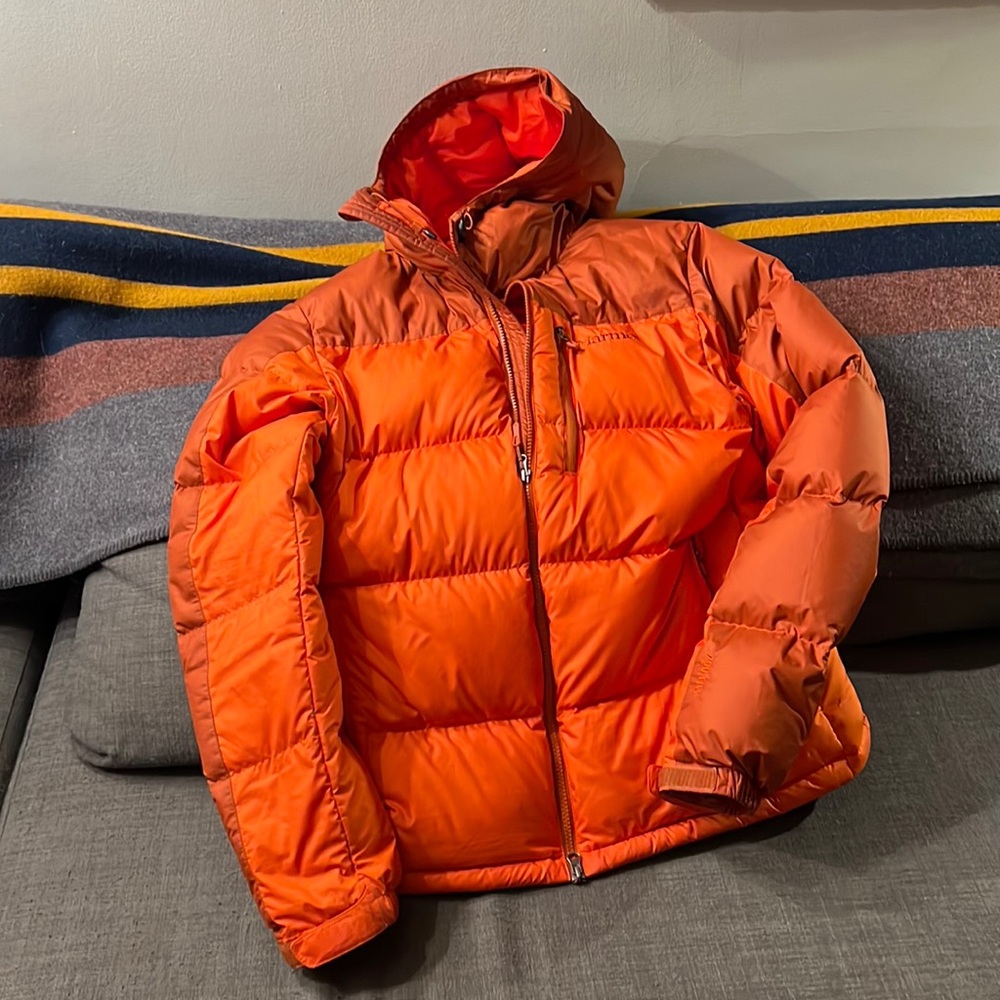 Men’s Marmot Guides down hoody in orange.